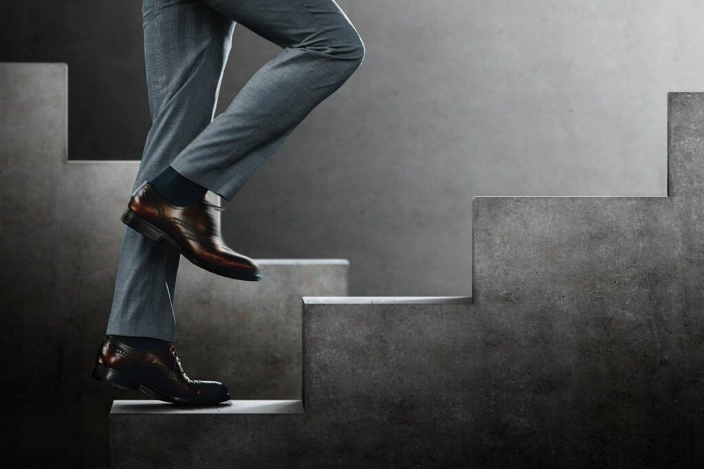 business man climbing stairs
