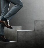 business man climbing stairs